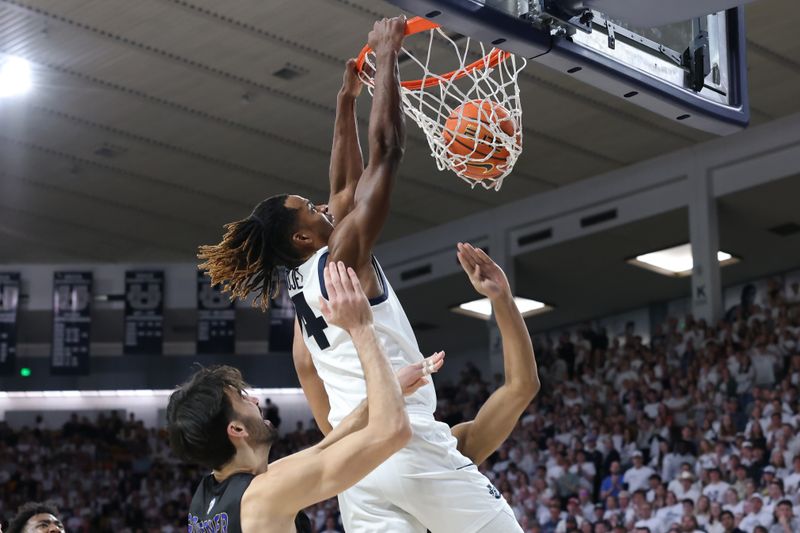 Jan 30, 2024; Logan, Utah, USA; Utah State Aggies guard Ian Martinez (4) dunks the ball against the San Jose State Spartans during the second half at Dee Glen Smith Spectrum. Mandatory Credit: Rob Gray-USA TODAY Sports