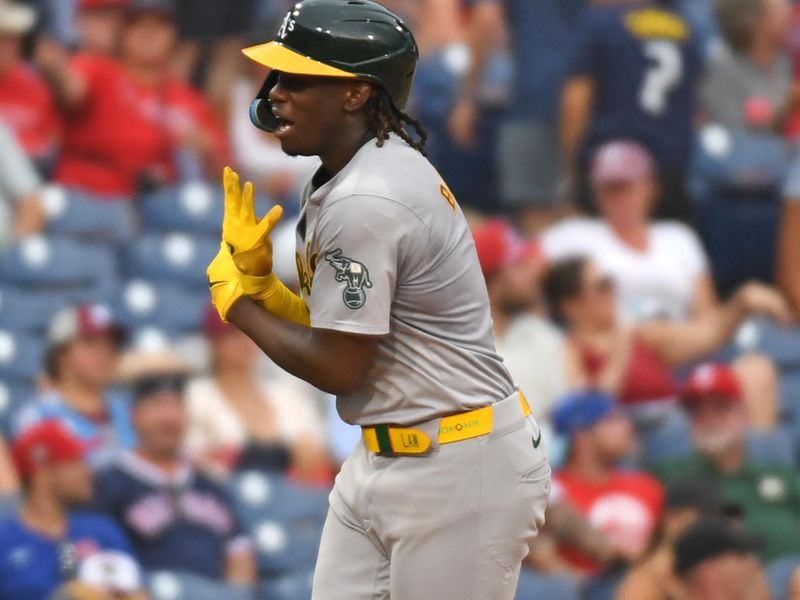 Jul 14, 2024; Philadelphia, Pennsylvania, USA; Oakland Athletics outfielder Lawrence Butler (4) celebrates his third home run of the game against the Philadelphia Phillies during the seventh inning at Citizens Bank Park. Mandatory Credit: Eric Hartline-USA TODAY Sports