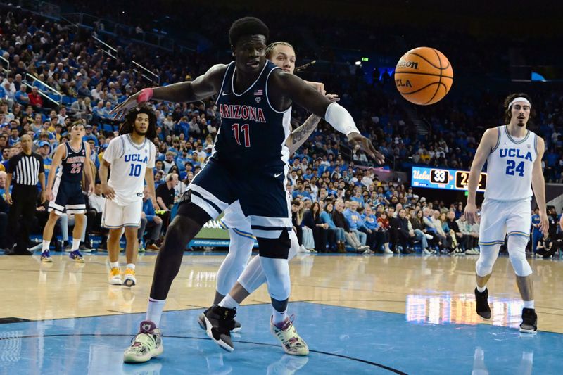 Mar 4, 2023; Los Angeles, California, USA;  Arizona Wildcats center Oumar Ballo (11) drives tot he basket during the first half against UCLA Bruins at Pauley Pavilion presented by Wescom. Mandatory Credit: Richard Mackson-USA TODAY Sports