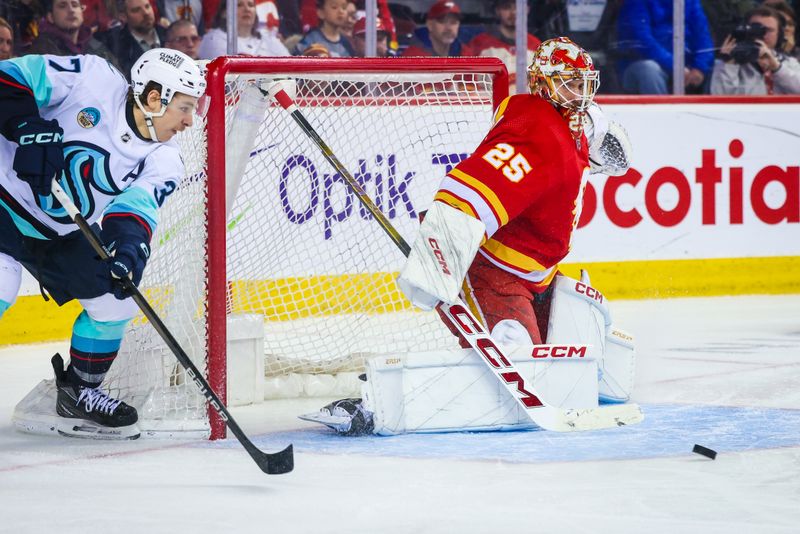 Mar 4, 2024; Calgary, Alberta, CAN; Calgary Flames goaltender Jacob Markstrom (25) makes a save against Seattle Kraken center Yanni Gourde (37) during the third period at Scotiabank Saddledome. Mandatory Credit: Sergei Belski-USA TODAY Sports