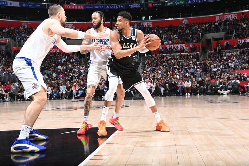 LOS ANGELES, CA - MARCH 10: Giannis Antetokounmpo #34 of the Milwaukee Bucks looks to pass the ball during the game against the LA Clippers on March 10, 2024 at Crypto.Com Arena in Los Angeles, California. NOTE TO USER: User expressly acknowledges and agrees that, by downloading and/or using this Photograph, user is consenting to the terms and conditions of the Getty Images License Agreement. Mandatory Copyright Notice: Copyright 2024 NBAE (Photo by Andrew D. Bernstein/NBAE via Getty Images)