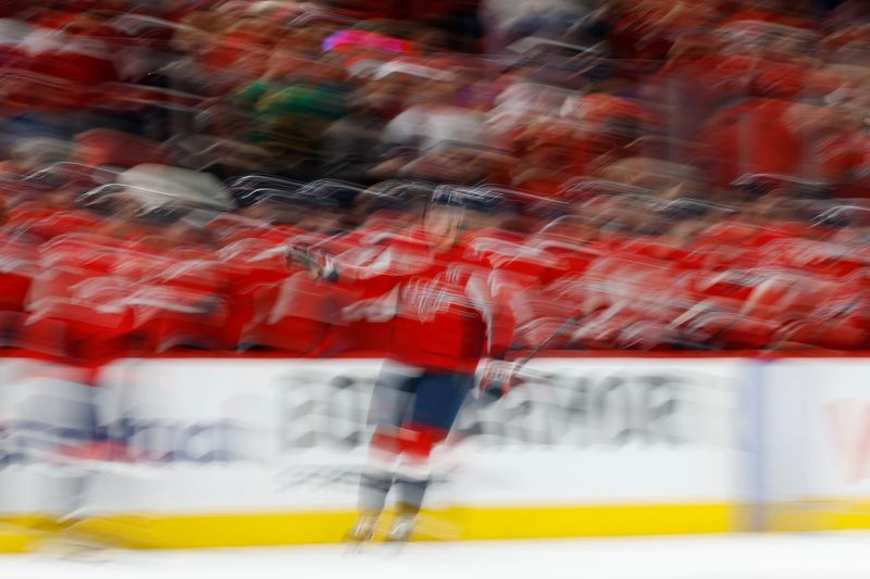 May 6, 2025; Washington, District of Columbia, USA; Washington Capitals center Aliaksei Protas (21) celebrates with teammates after scoring a goal against the Carolina Hurricanes in the second period in game one of the second round of the 2025 Stanley Cup Playoffs at Capital One Arena. Mandatory Credit: Geoff Burke-Imagn Images