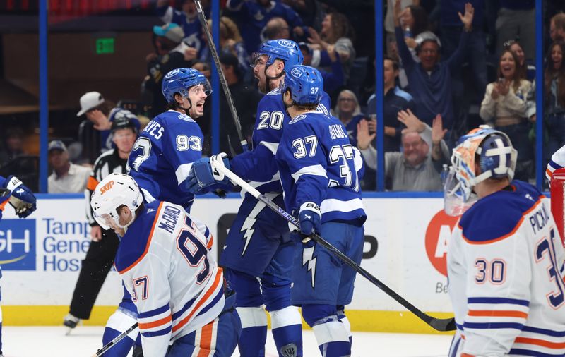 Nov 20, 2025; Tampa, Florida, USA;  Tampa Bay Lightning left wing Nick Paul (20) is congratulated after he scored a goal against the Edmonton Oilers during the third period at Benchmark International Arena. Mandatory Credit: Kim Klement Neitzel-Imagn Images