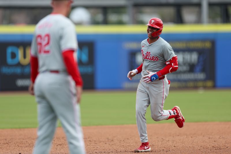 Feb 29, 2024; Dunedin, Florida, USA;  Philadelphia Phillies left fielder Cristian Pache (19) rounds the bases after hitting a solo home run against the Toronto Blue Jays in the sixth inning at TD Ballpark. Mandatory Credit: Nathan Ray Seebeck-USA TODAY Sports