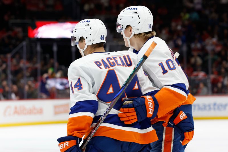 Oct 31, 2025; Washington, District of Columbia, USA; New York Islanders center Jean-Gabriel Pageau (44) celebrates with Islanders right wing Simon Holmstrom (10) after scoring a goal against the Washington Capitals during the second period at Capital One Arena. Mandatory Credit: Geoff Burke-Imagn Images