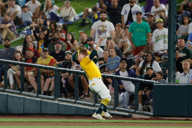 May 20, 2025; West Sacramento, California, USA; Athletics second baseman Luis Urías (17) catches a pop fly during the sixth inning against the Los Angeles Angels at Sutter Health Park. Mandatory Credit: Sergio Estrada-Imagn Images