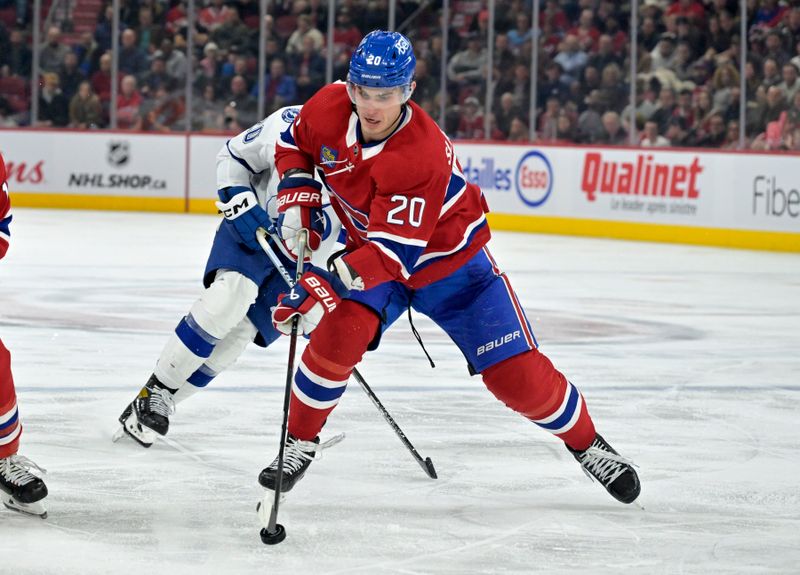 Nov 7, 2023; Montreal, Quebec, CAN; Montreal Canadiens forward Juraj Slafkovsky (20) plays the puck during the third period of the game against the Tampa Bay Lightning at the Bell Centre. Mandatory Credit: Eric Bolte-USA TODAY Sports