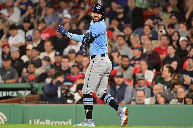 Sep 27, 2024; Boston, Massachusetts, USA; Tampa Bay Rays shortstop Jose Caballero (7)  reacts to being hit by a pitch during the seventh inning against the Boston Red Sox at Fenway Park. Mandatory Credit: Eric Canha-Imagn Images