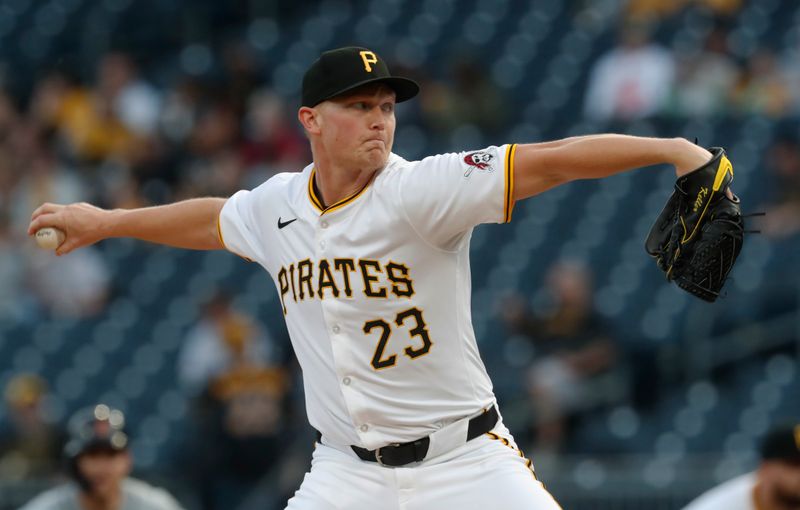 Apr 8, 2024; Pittsburgh, Pennsylvania, USA;  Pittsburgh Pirates starting pitcher Mitch Keller (23) delivers a pitch against the Detroit Tigers during the first inning at PNC Park. Mandatory Credit: Charles LeClaire-USA TODAY Sports