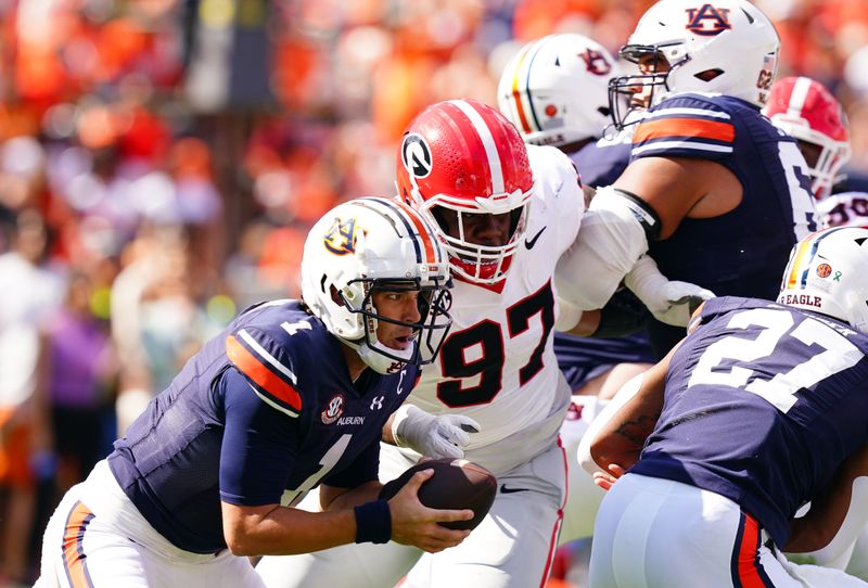 Sep 30, 2023; Auburn, Alabama, USA; Auburn Tigers quarterback Payton Thorne (1) scrambles up the field against the Georgia Bulldogs during the first quarter at Jordan-Hare Stadium. Mandatory Credit: John David Mercer-USA TODAY Sports