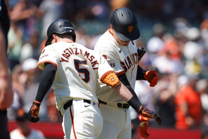 Jul 11, 2024; San Francisco, California, USA; San Francisco Giants outfielder Mike Yastrzemski (5) is greeted by first base Wilmer Flores (41) after hitting a one run home run during the ninth inning against the Toronto Blue Jays at Oracle Park. Mandatory Credit: Sergio Estrada-USA TODAY Sports