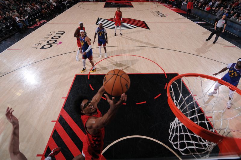 PORTLAND, OR - MARCH 23: Scoot Henderson #00 of the Portland Trail Blazers drives to the basket during the game against the Denver Nuggets on March 23, 2024 at the Moda Center Arena in Portland, Oregon. NOTE TO USER: User expressly acknowledges and agrees that, by downloading and or using this photograph, user is consenting to the terms and conditions of the Getty Images License Agreement. Mandatory Copyright Notice: Copyright 2024 NBAE (Photo by Cameron Browne/NBAE via Getty Images)