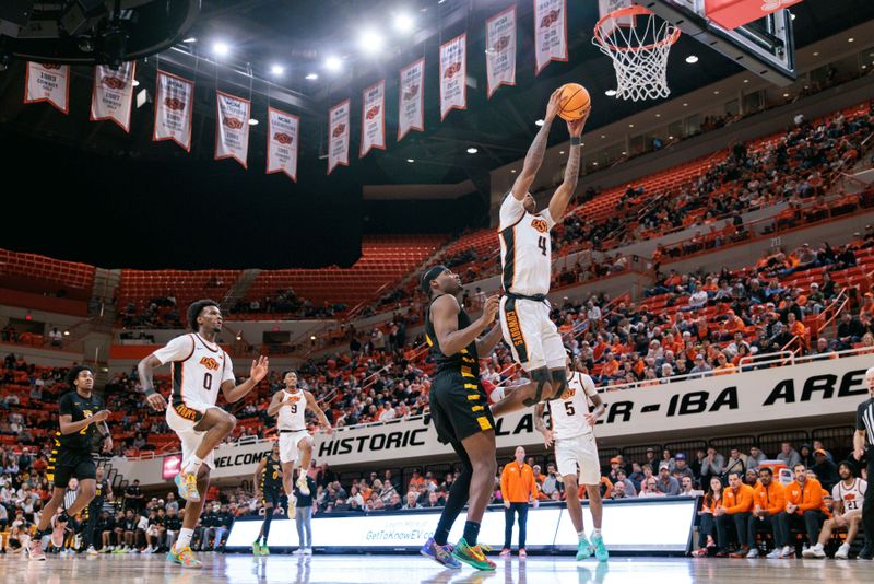Dec 29, 2025; Stillwater, Oklahoma, USA; Oklahoma State Cowboys guard Christian Coleman (4) drives to the basket during the second half against the Bethune-Cookman Wildcats at Gallagher-Iba Arena. Mandatory Credit: William Purnell-Imagn Images