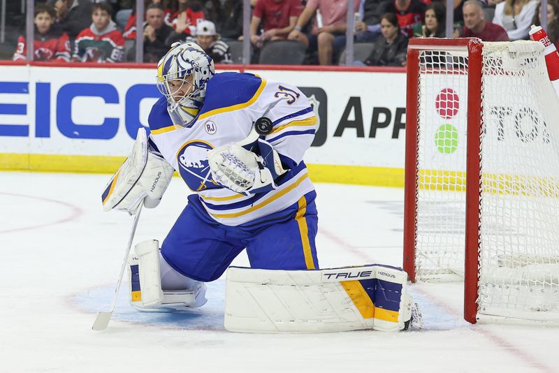 Oct 27, 2023; Newark, New Jersey, USA; Buffalo Sabres goaltender Eric Comrie (31) makes a save during the first period against the New Jersey Devils at Prudential Center. Mandatory Credit: Vincent Carchietta-USA TODAY Sports