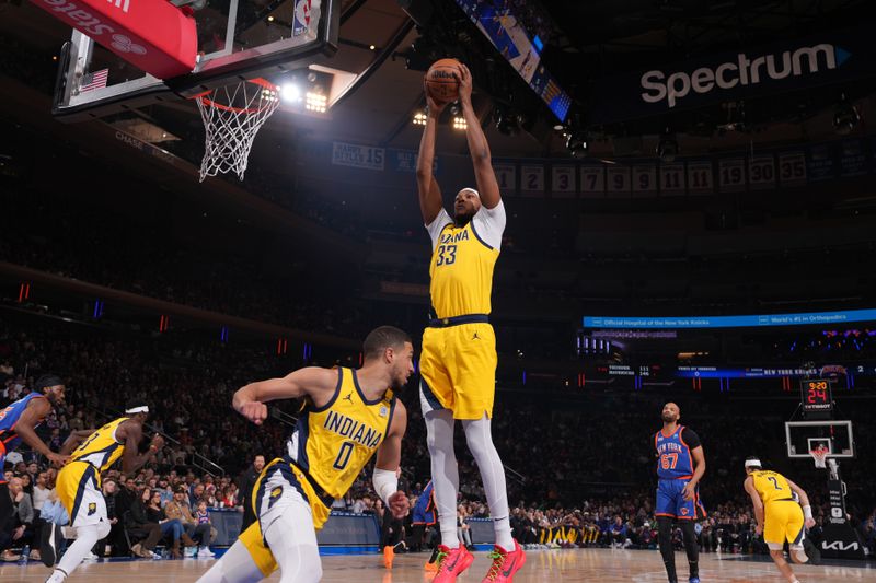 NEW YORK, NY - FEBRUARY 10: Myles Turner #33 of the Indiana Pacers rebounds the ball during the game against the New York Knicks on February 10, 2024 at Madison Square Garden in New York City, New York.  NOTE TO USER: User expressly acknowledges and agrees that, by downloading and or using this photograph, User is consenting to the terms and conditions of the Getty Images License Agreement. Mandatory Copyright Notice: Copyright 2024 NBAE  (Photo by Jesse D. Garrabrant/NBAE via Getty Images)