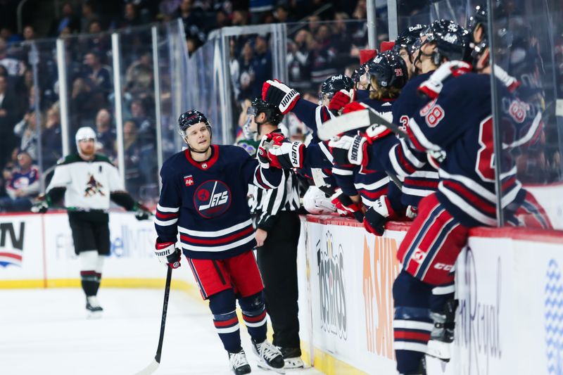 Nov 18, 2023; Winnipeg, Manitoba, CAN;  Winnipeg Jets forward Vladislav Namestnikov (7) is congratulated by his team mates on his goal against the Arizona Coyotes during the first period at Canada Life Centre. Mandatory Credit: Terrence Lee-USA TODAY Sports