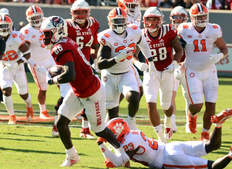 Sep 25, 2021; Raleigh, North Carolina, USA; North Carolina State Wolfpack wide receiver Emeka Emezie (86) runs after the catch during the first half against the Clemson Tigers at Carter-Finley Stadium. Mandatory Credit: Rob Kinnan-USA TODAY Sports