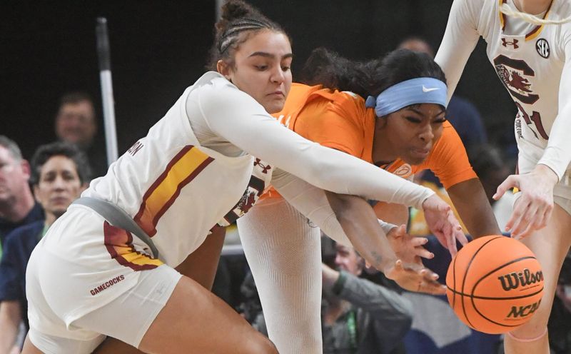 Mar 9, 2024; Greenville, SC, USA; South Carolina Gamecocks guard Tessa Johnson (5) steals a ball from Tennessee Lady Vols forward Rickea Jackson (2) during the second quarter at the Bon Secours Wellness Arena. Mandatory Credit: Ken Ruinard/The Greenville News via USA TODAY NETWORK