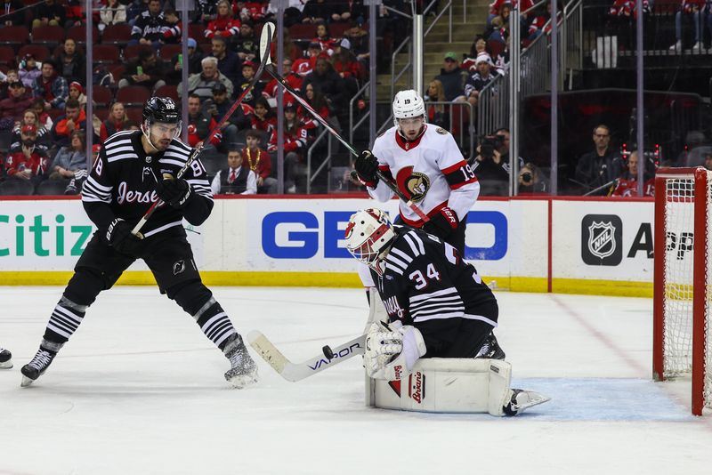 Mar 23, 2024; Newark, New Jersey, USA; New Jersey Devils goaltender Jake Allen (34) makes a save against the Ottawa Senators during the third period at Prudential Center. Mandatory Credit: Ed Mulholland-USA TODAY Sports