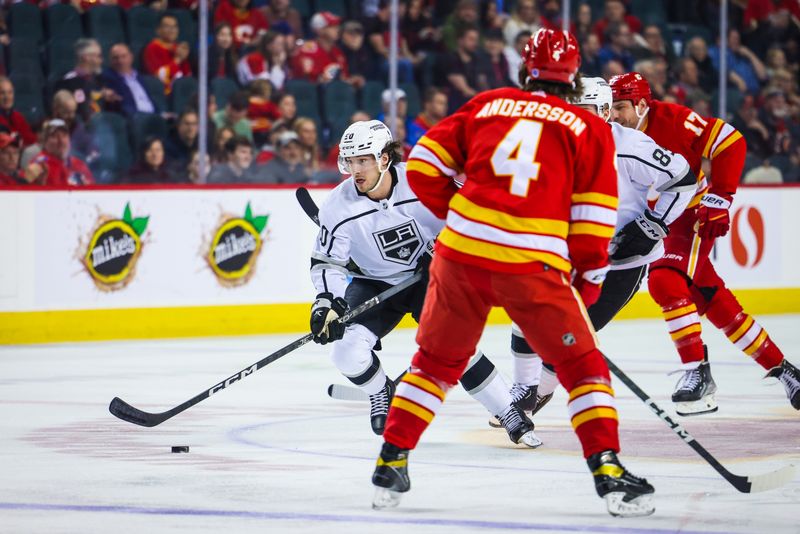 Mar 28, 2023; Calgary, Alberta, CAN; Los Angeles Kings defenseman Sean Durzi (50) controls the puck against the Calgary Flames during the first period at Scotiabank Saddledome. Mandatory Credit: Sergei Belski-USA TODAY Sports