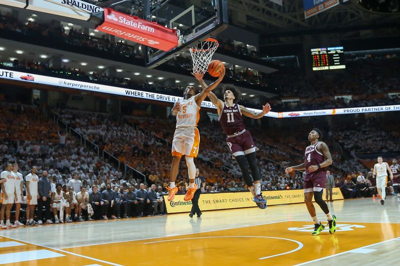 Feb 24, 2024; Knoxville, Tennessee, USA; Tennessee Volunteers guard Zakai Zeigler (5) goes to the basket against Texas A&M Aggies forward Andersson Garcia (11) during the second half at Thompson-Boling Arena at Food City Center. Mandatory Credit: Randy Sartin-USA TODAY Sports