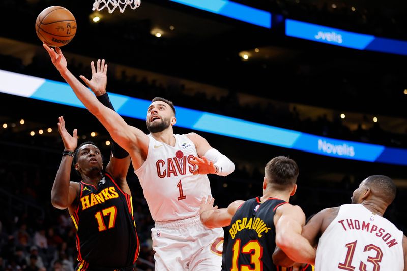 ATLANTA, GEORGIA - JANUARY 20: Max Strus #1 of the Cleveland Cavaliers draws a foul against Onyeka Okongwu #17 of the Atlanta Hawks during the first half at State Farm Arena on January 20, 2024 in Atlanta, Georgia. NOTE TO USER: User expressly acknowledges and agrees that, by downloading and or using this photograph, User is consenting to the terms and conditions of the Getty Images License Agreement. (Photo by Alex Slitz/Getty Images)