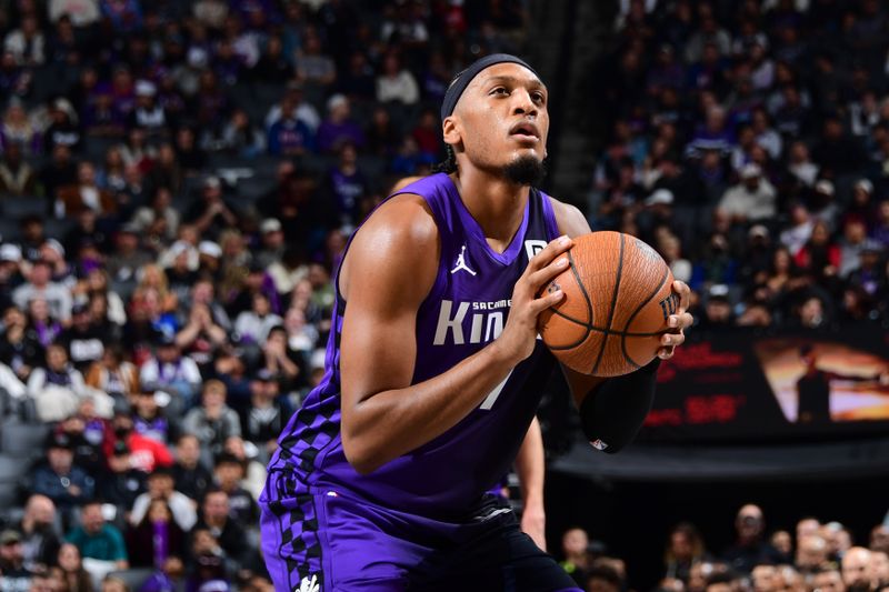 SACRAMENTO, CA - DECEMBER 3: Issac Jones #17 of the Sacramento Kings shoots a free throw during the game against the Houston Rockets during the Emirates NBA Cup game on December 3, 2024 at Golden 1 Center in Sacramento, California. NOTE TO USER: User expressly acknowledges and agrees that, by downloading and or using this Photograph, user is consenting to the terms and conditions of the Getty Images License Agreement. Mandatory Copyright Notice: Copyright 2024 NBAE (Photo by Adam Pantozzi/NBAE via Getty Images)