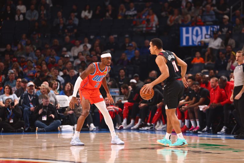 OKLAHOMA CITY, OK - JANUARY 23: Shai Gilgeous-Alexander #2 of the Oklahoma City Thunder plays defense against Malcolm Brogdon #11 of the Portland Trail Blazers during the game on January 23, 2024 at Paycom Arena in Oklahoma City, Oklahoma. NOTE TO USER: User expressly acknowledges and agrees that, by downloading and or using this photograph, User is consenting to the terms and conditions of the Getty Images License Agreement. Mandatory Copyright Notice: Copyright 2024 NBAE (Photo by Zach Beeker/NBAE via Getty Images)