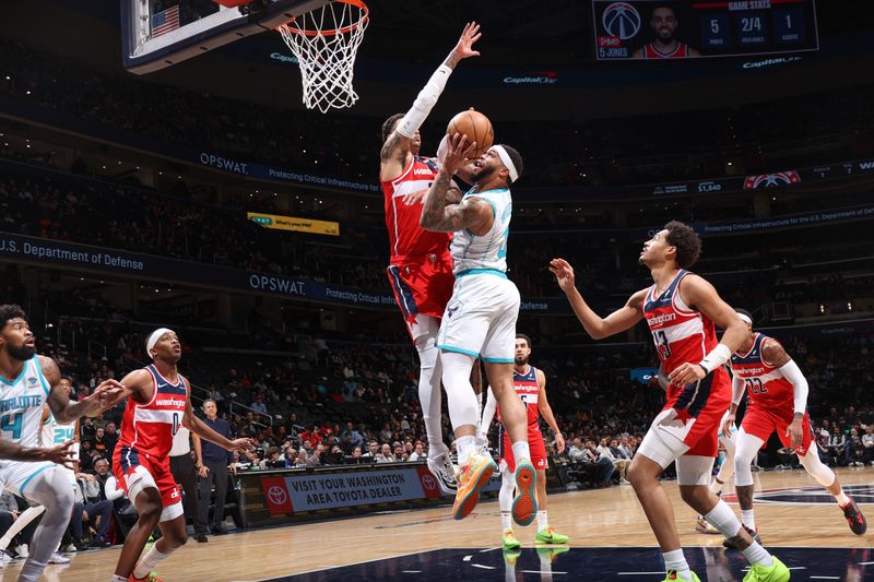 WASHINGTON, DC -? MARCH 8:  Miles Bridges #0 of the Charlotte Hornets goes to the basket during the game on March 8, 2024 at Capital One Arena in Washington, DC. NOTE TO USER: User expressly acknowledges and agrees that, by downloading and or using this Photograph, user is consenting to the terms and conditions of the Getty Images License Agreement. Mandatory Copyright Notice: Copyright 2024 NBAE (Photo by Stephen Gosling/NBAE via Getty Images)