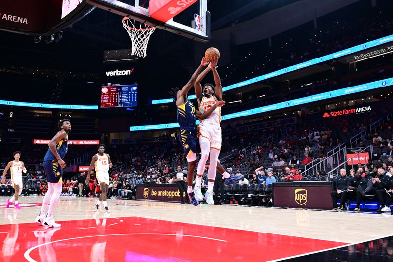 ATLANTA, GA - OCTOBER 8: De'Andre Hunter #12 of the Atlanta Hawks drives to the basket during the game against the Indiana Pacers during a NBA preseason game on October 8, 2024 at State Farm Arena in Atlanta, Georgia.  NOTE TO USER: User expressly acknowledges and agrees that, by downloading and/or using this Photograph, user is consenting to the terms and conditions of the Getty Images License Agreement. Mandatory Copyright Notice: Copyright 2024 NBAE (Photo by Adam Hagy/NBAE via Getty Images)