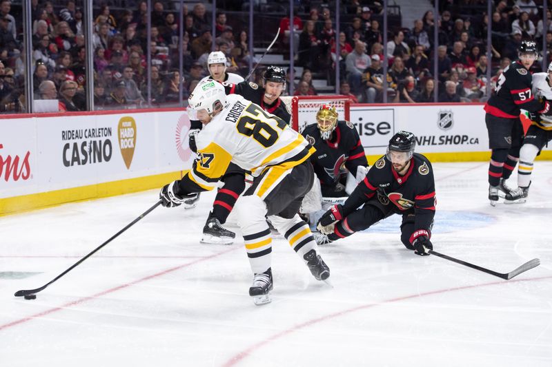 Mar 12, 2024; Ottawa, Ontario, CAN; Pittsburgh Penguins center Sidney Crosby (87) controls the puck in the second period against the Ottawa Senators at the Canadian Tire Centre. Mandatory Credit: Marc DesRosiers-USA TODAY Sports