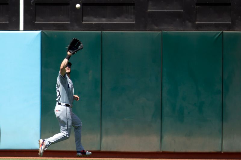 Aug 7, 2024; Oakland, California, USA; Chicago White Sox left fielder Andrew Benintendi (23) makes the catch of a sacrifice fly by Oakland Athletics right fielder Lawrence Butler during the seventh inning at Oakland-Alameda County Coliseum. Mandatory Credit: D. Ross Cameron-USA TODAY Sports