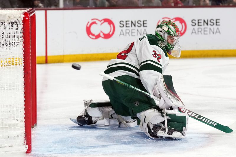 Mar 12, 2023; Tempe, Arizona, USA; Minnesota Wild goaltender Filip Gustavsson (32) makes a save against the Arizona Coyotes during the second period at Mullett Arena. Mandatory Credit: Joe Camporeale-USA TODAY Sports