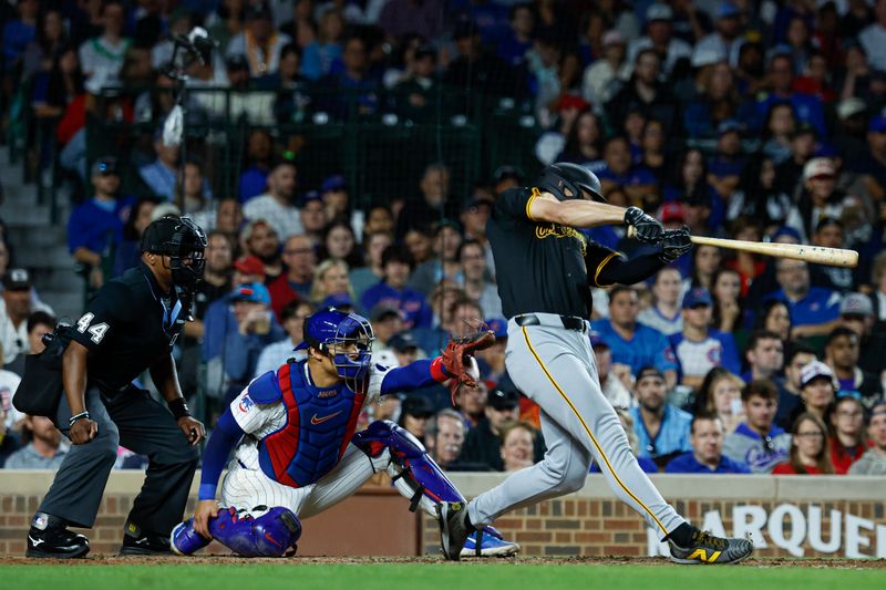 Sep 2, 2024; Chicago, Illinois, USA; Pittsburgh Pirates outfielder Bryan Reynolds (10) hits a three-run home run against the Chicago Cubs during the eight inning against the Chicago Cubs at Wrigley Field. Mandatory Credit: Kamil Krzaczynski-USA TODAY Sports