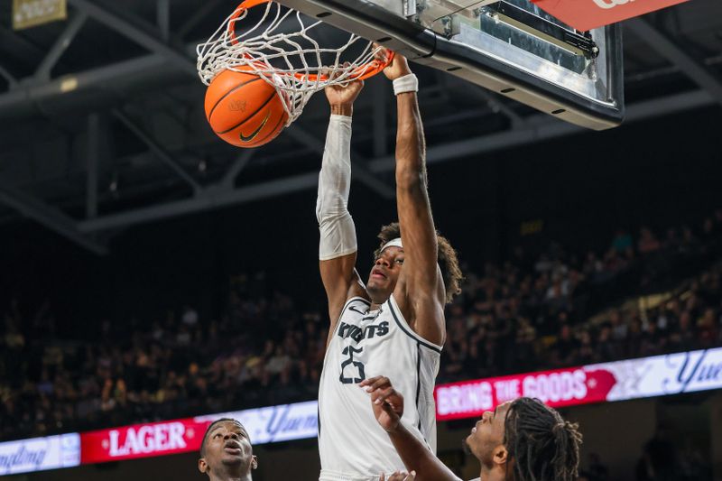 Jan 25, 2023; Orlando, Florida, USA; UCF Knights forward Taylor Hendricks (25) dunks the ball during the first half against the Houston Cougars at Addition Financial Arena. Mandatory Credit: Mike Watters-USA TODAY Sports