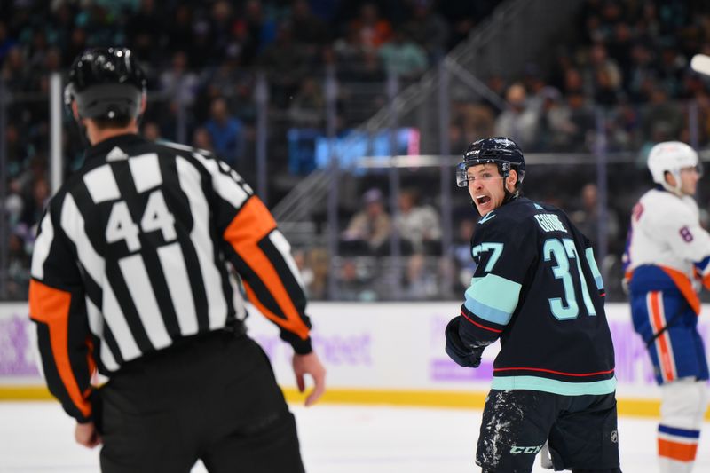 Nov 16, 2023; Seattle, Washington, USA; Seattle Kraken center Yanni Gourde (37) communicates with referee Justin Kea (44) during the first period at Climate Pledge Arena. Mandatory Credit: Steven Bisig-USA TODAY Sports
