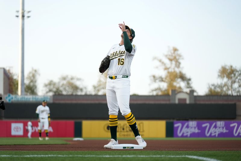 Apr 23, 2025; West Sacramento, California, USA; Athletics first baseman Nick Kurtz (16) points to the sky before the start of the game against the Texas Rangers at Sutter Health Park. Mandatory Credit: Cary Edmondson-Imagn Images
