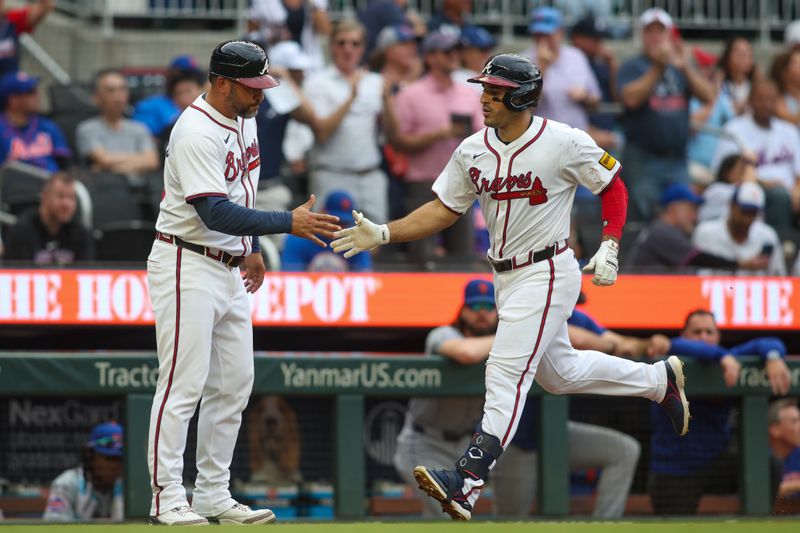 Sep 30, 2024; Atlanta, Georgia, USA; Atlanta Braves left fielder Ramon Laureano (18) celebrates after a home run with third base coach Matt Tuiasosopo (89) against the New York Mets in the sixth inning at Truist Park. Mandatory Credit: Brett Davis-Imagn Images
