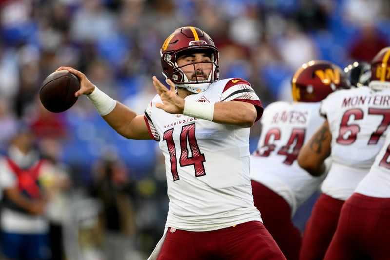 Washington Commanders quarterback Sam Howell throws to a receiver in the first half of a preseason NFL football game against the Baltimore Ravens, Saturday, Aug. 27, 2022, in Baltimore. (AP Photo/Nick Wass)