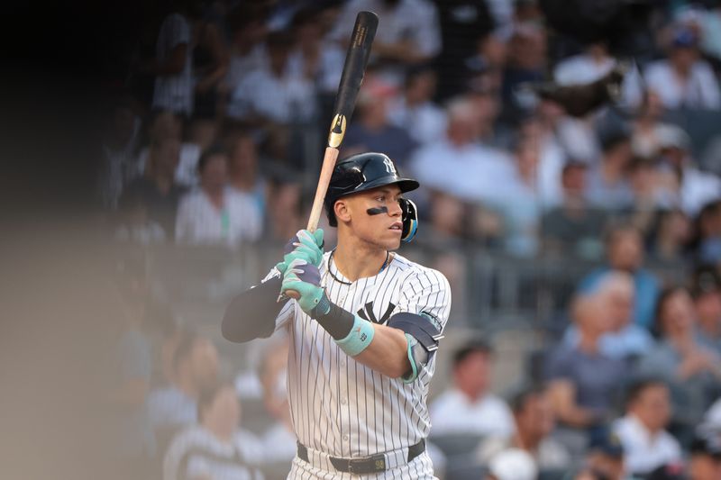 Jun 18, 2024; Bronx, New York, USA; New York Yankees center fielder Aaron Judge (99) looks on from the on deck circle during the first inning against the Baltimore Orioles at Yankee Stadium. Mandatory Credit: Vincent Carchietta-USA TODAY Sports