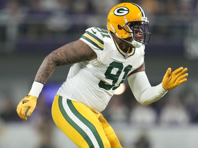 Green Bay Packers linebacker Preston Smith (91) in action during the first half of an NFL football game against the Minnesota Vikings, Sunday, Dec. 31, 2023, in Minneapolis. (AP Photo/Abbie Parr)