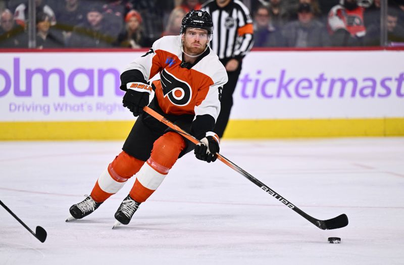 Nov 28, 2023; Philadelphia, Pennsylvania, USA; Philadelphia Flyers defenseman Cam York (8) passes the puck against the Carolina Hurricanes in the third period at Wells Fargo Center. Mandatory Credit: Kyle Ross-USA TODAY Sports