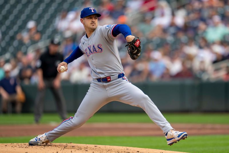 Jun 10, 2025; Minneapolis, Minnesota, USA; Texas Rangers starting pitcher Tyler Mahle (51) delivers a pitch against the Minnesota Twins in the first inning at Target Field. Mandatory Credit: Jesse Johnson-Imagn Images