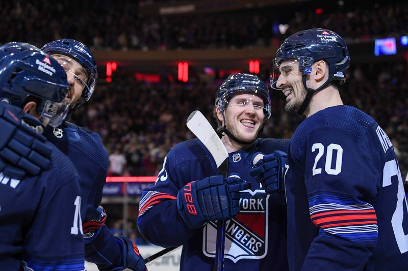 Dec 23, 2023; New York, New York, USA; New York Rangers defenseman Adam Fox (23) and New York Rangers left wing Chris Kreider (20) celebrate the goal by New York Rangers left wing Artemi Panarin (10) against the Buffalo Sabres during the first period at Madison Square Garden. Mandatory Credit: Dennis Schneidler-USA TODAY Sports