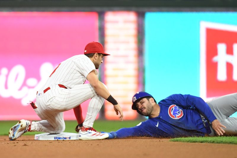 Sep 23, 2024; Philadelphia, Pennsylvania, USA; Philadelphia Phillies shortstop Trea Turner (7) tags out Chicago Cubs outfielder Mike Tauchman (40) while trying to steal second base during the first inning at Citizens Bank Park. Mandatory Credit: Eric Hartline-Imagn Images