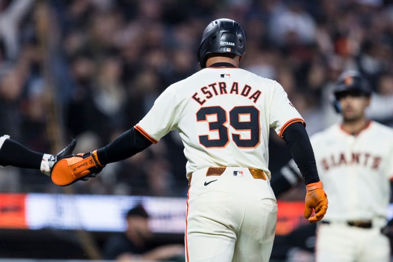 May 15, 2024; San Francisco, California, USA; San Francisco Giants second baseman Thairo Estrada (39) celebrates after scoring against the Los Angeles Dodgers during the sixth inning at Oracle Park. Mandatory Credit: John Hefti-USA TODAY Sports