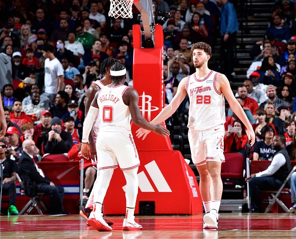 HOUSTON, TX - DECEMBER 27:   Alperen Sengun #28 of the Houston Rockets is congratulated during the game agaisnt the Phoenix Suns on December 27, 2023 at the Toyota Center in Houston, Texas. NOTE TO USER: User expressly acknowledges and agrees that, by downloading and or using this photograph, User is consenting to the terms and conditions of the Getty Images License Agreement. Mandatory Copyright Notice: Copyright 2023 NBAE (Photo by Logan Riely/NBAE via Getty Images)