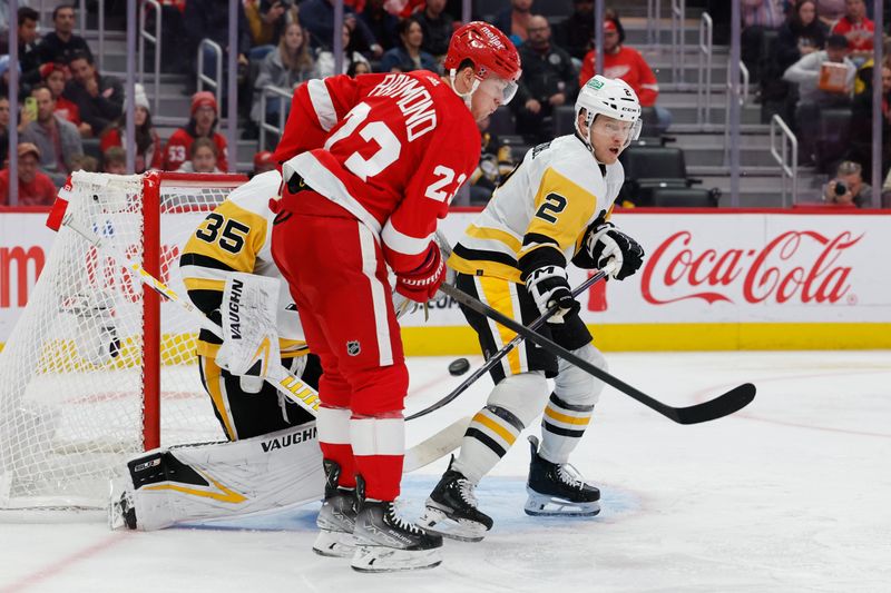 Oct 18, 2023; Detroit, Michigan, USA; Detroit Red Wings left wing Lucas Raymond (23) screens Pittsburgh Penguins goaltender Tristan Jarry (35) on a goal in front of defenseman Chad Ruhwedel (2) in the second period at Little Caesars Arena. Mandatory Credit: Rick Osentoski-USA TODAY Sports