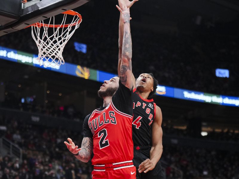 TORONTO, ON - JANUARY 31: Lonzo Ball #2 of the Chicago Bulls goes to the basket against Scottie Barnes #4 of the Toronto Raptors during the second half of their basketball game at the Scotiabank Arena on January 31, 2025 in Toronto, Ontario, Canada. NOTE TO USER: User expressly acknowledges and agrees that, by downloading and/or using this Photograph, user is consenting to the terms and conditions of the Getty Images License Agreement. (Photo by Mark Blinch/Getty Images)