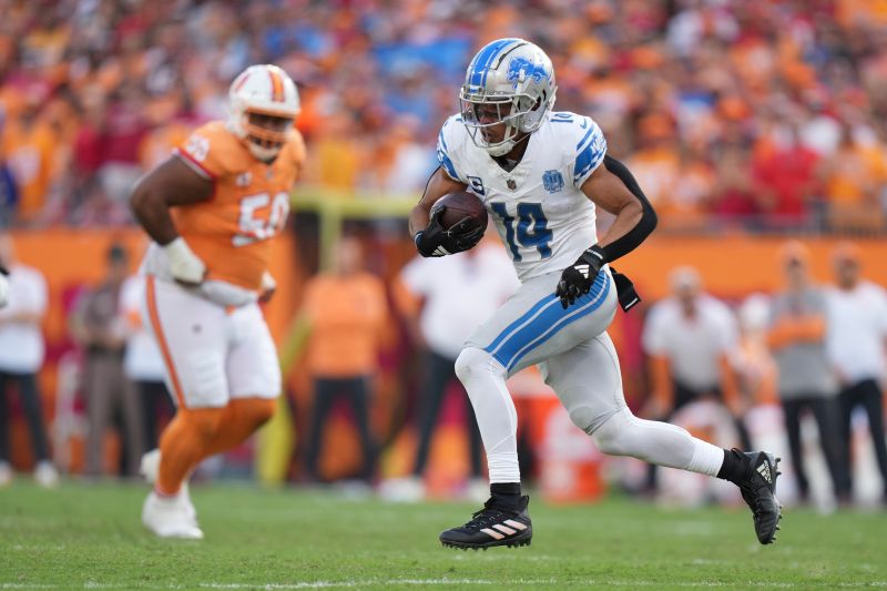 Detroit Lions wide receiver Amon-Ra St. Brown (14) runs for a touchdown after a reception during an NFL football game against the Tampa Bay Buccaneers, Sunday, Oct. 15 2023, in Tampa, Fla. (AP Photo/Peter Joneleit)